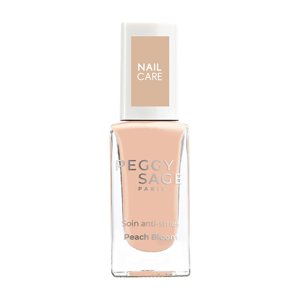Soin perfecteur façon "CC nails", ce vernis hybride sublime l'apparence naturelle de l'ongle : il floute les imperfections et dépose un voile glossy